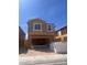 New construction showing the house framing, showcasing modern design and large window openings under a clear blue sky at 9989 River Corral St, Las Vegas, NV 89166
