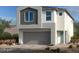 Charming two-story home featuring a modern design and a spacious two-car garage at 9989 River Corral St, Las Vegas, NV 89166
