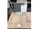 Showcasing sleek chrome faucet, grey cabinets, 'Liberty Calacatta' quartz, and 'Silver Dollar' vinyl plank at 9989 River Corral St, Las Vegas, NV 89166