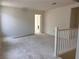 Second floor loft area with carpet flooring, white walls, and natural light at 9989 River Corral St, Las Vegas, NV 89166