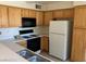 A functional kitchen features bright cabinetry and essential appliances for easy meal preparation at , Las Vegas, NV 89122