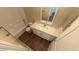 Bathroom featuring a shower-tub combo, toilet, and vanity with a sink at 1931 Rose Ct, Pahrump, NV 89048