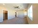 Carpeted bedroom with ceiling fan and walk-in closet at 1931 Rose Ct, Pahrump, NV 89048