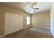 Bedroom with neutral carpet, ceiling fan, closet and window at 1931 Rose Ct, Pahrump, NV 89048