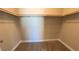 Walk-in closet featuring built-in shelving and neutral carpet at 1931 Rose Ct, Pahrump, NV 89048