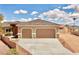 Attractive home featuring a spacious driveway, two-car garage, and neat front yard at 1931 Rose Ct, Pahrump, NV 89048