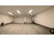 A spacious garage with two overhead doors, white walls, and high ceilings at 1931 Rose Ct, Pahrump, NV 89048