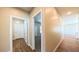Hallway with wood floors and neutral walls leading to various rooms in the home at 1931 Rose Ct, Pahrump, NV 89048