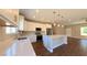 Updated kitchen with quartz countertops, stainless steel appliances, and a spacious center island at 1931 Rose Ct, Pahrump, NV 89048
