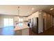 Well-lit kitchen with stainless steel appliances, modern white cabinets, and a center island at 1931 Rose Ct, Pahrump, NV 89048