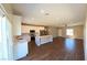 Modern kitchen with white cabinets, stainless steel appliances, and a center island with pendant lighting at 1931 Rose Ct, Pahrump, NV 89048