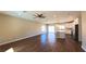 Spacious living room showcasing hardwood floors, recessed lighting, and an open floor plan to the kitchen at 1931 Rose Ct, Pahrump, NV 89048