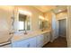 Bright main bathroom with double vanity and modern fixtures at 1931 Rose Ct, Pahrump, NV 89048