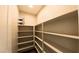 Walk-in pantry with ample shelving for organized storage at 1931 Rose Ct, Pahrump, NV 89048