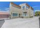 Large backyard featuring a concrete patio, secure fencing, and comfortable seating at 2641 Vendange Pl, Henderson, NV 89044