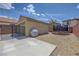 Wide backyard featuring a grill, trampoline, and gravel at 2641 Vendange Pl, Henderson, NV 89044