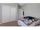Bedroom featuring white sliding door closets and neutral-colored walls at 2641 Vendange Pl, Henderson, NV 89044