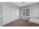 Comfortable bedroom featuring carpet, a window, and a closet with sliding doors at 2641 Vendange Pl, Henderson, NV 89044