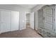 Bedroom with a large armoire, closet, and access to the hallway for an open feel at 2641 Vendange Pl, Henderson, NV 89044