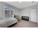 Neutral bedroom featuring a desk, storage, and a window at 2641 Vendange Pl, Henderson, NV 89044