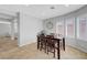 Dining area with natural light from bay windows and elegant tile flooring at 2641 Vendange Pl, Henderson, NV 89044