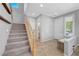 Inviting entryway with staircase, tile floors, and natural light at 2641 Vendange Pl, Henderson, NV 89044