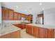 Spacious kitchen with granite counters, stainless steel appliances, wood cabinetry, and recessed lighting at 2641 Vendange Pl, Henderson, NV 89044
