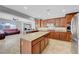 Open concept kitchen featuring an island and stainless steel appliances with lots of cabinet space at 2641 Vendange Pl, Henderson, NV 89044