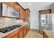 Kitchen boasts stainless steel appliances, granite countertops, and custom cabinetry at 2641 Vendange Pl, Henderson, NV 89044