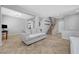 Spacious open-concept living room with tile flooring, neutral tones, and plenty of natural light at 2641 Vendange Pl, Henderson, NV 89044