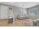 Bright living room featuring tile floors, fresh neutral paint, window shutters and comfortable seating at 2641 Vendange Pl, Henderson, NV 89044