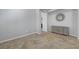 Open concept living room showcasing tile floors and a modern console table with decorative mirror at 2641 Vendange Pl, Henderson, NV 89044