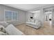 Open concept living area with plantation shutters, neutral paint, and tile flooring at 2641 Vendange Pl, Henderson, NV 89044