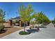 Community picnic area featuring covered seating, stone pillars, landscaping, and picturesque walking paths at 2641 Vendange Pl, Henderson, NV 89044