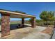 Community picnic area with stone pillars, a covered seating area, and views of the surrounding neighborhood at 2641 Vendange Pl, Henderson, NV 89044