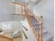 Inviting staircase with carpeted steps and a wooden handrail leading to the upper level at 2641 Vendange Pl, Henderson, NV 89044