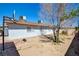 Backyard with mature trees, exterior of the home, and basketball hoop at 3254 Greenbriar Dr, Las Vegas, NV 89121