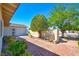 Private backyard featuring brick pathway, lush greenery, mature trees, and a serene setting at 3254 Greenbriar Dr, Las Vegas, NV 89121