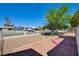 Serene backyard featuring a tiled patio, shade tree, and low-maintenance landscaping at 3254 Greenbriar Dr, Las Vegas, NV 89121