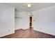 Bedroom features an open closet, wood floors, a ceiling fan, and an ensuite bathroom at 3254 Greenbriar Dr, Las Vegas, NV 89121