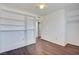 This bedroom features modern wood floors, shelving, and an open closet at 3254 Greenbriar Dr, Las Vegas, NV 89121