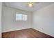 The bedroom features natural lighting, modern wood floors, and a ceiling fan at 3254 Greenbriar Dr, Las Vegas, NV 89121