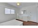 Bedroom boasts bright natural light from the window, wood-look floors, a ceiling fan, and dresser at 3254 Greenbriar Dr, Las Vegas, NV 89121