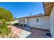Quaint single-story home with a brick walkway, security door, and established landscaping at 3254 Greenbriar Dr, Las Vegas, NV 89121