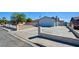 Single-story house boasting a spacious driveway, a well-kept front yard, and a secure fence at 3254 Greenbriar Dr, Las Vegas, NV 89121