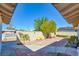 Charming front yard with brick pavers, mature trees, and partial privacy wall on a sunny day at 3254 Greenbriar Dr, Las Vegas, NV 89121