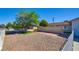 Attractive front yard with low-maintenance gravel landscaping, a healthy shade tree, and a neat lawn at 3254 Greenbriar Dr, Las Vegas, NV 89121