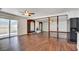 Open-concept living room boasts hardwood floors, access to the backyard, and plenty of natural light at 3254 Greenbriar Dr, Las Vegas, NV 89121