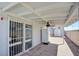 Covered patio with ceiling fan, block wall, and access to the back yard at 3254 Greenbriar Dr, Las Vegas, NV 89121
