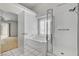 Clean bathroom offering a soaking tub with a shower head, plus a separate shower for all bathing needs at 3581 Pahrump Valley Blvd, Pahrump, NV 89048